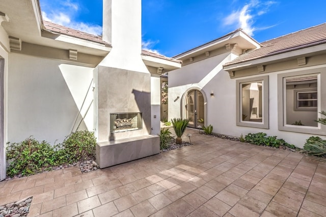 view of patio with a tile fireplace