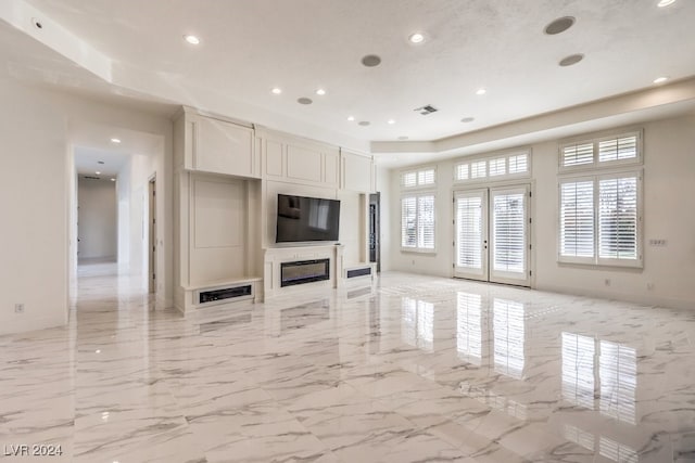 unfurnished living room with french doors