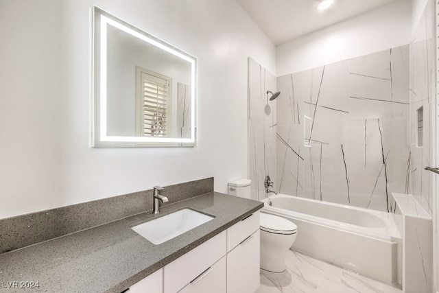 full bathroom with vanity, toilet, and tiled shower / bath