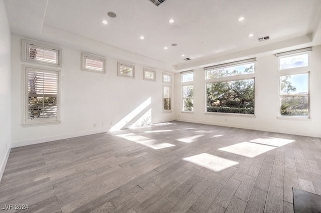 unfurnished room with light wood-type flooring