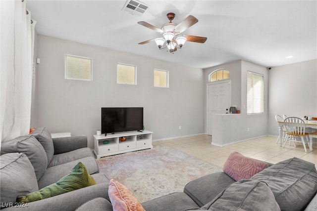 living room with light tile patterned floors and ceiling fan