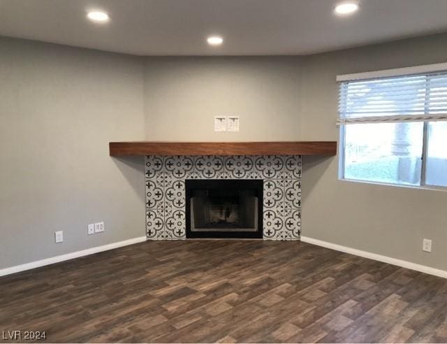 room details featuring a fireplace and hardwood / wood-style floors