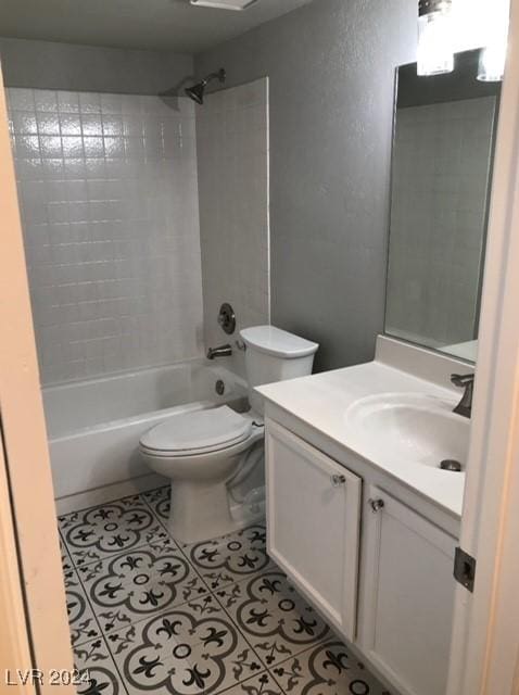 full bathroom featuring tile patterned floors, vanity, toilet, and tiled shower / bath