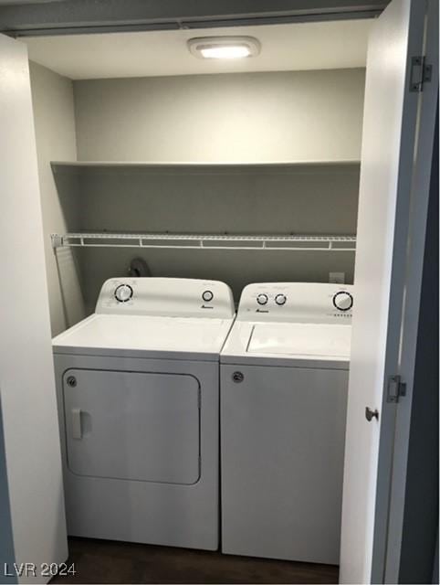 clothes washing area with washing machine and clothes dryer