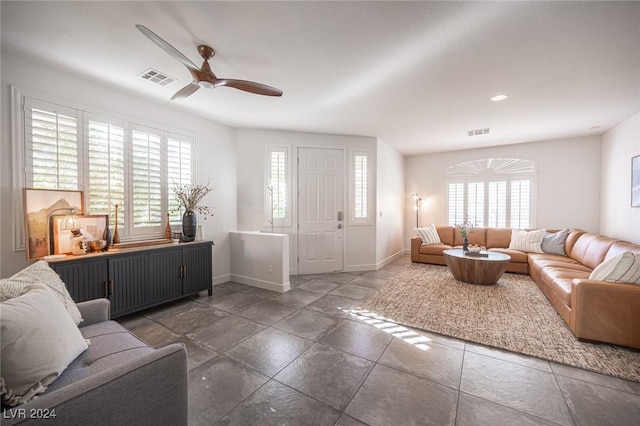 living room featuring ceiling fan and radiator