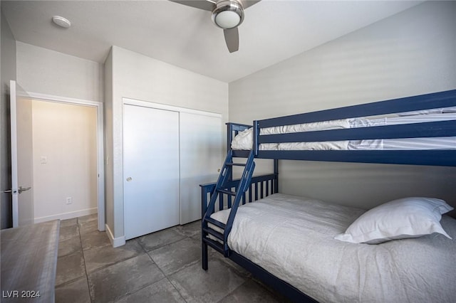 bedroom featuring a closet, ceiling fan, and lofted ceiling