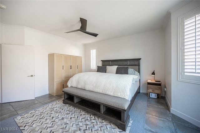 bedroom with multiple windows, ceiling fan, and ornamental molding