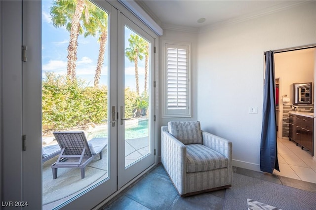 doorway to outside featuring tile patterned flooring, french doors, and ornamental molding