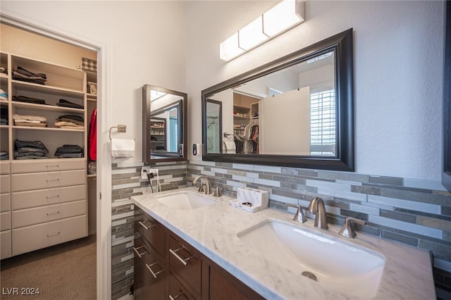 bathroom with vanity and backsplash