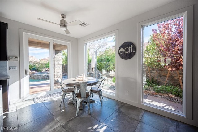 dining space with ceiling fan and a wealth of natural light