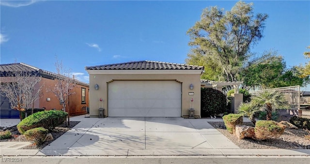 mediterranean / spanish house with a garage