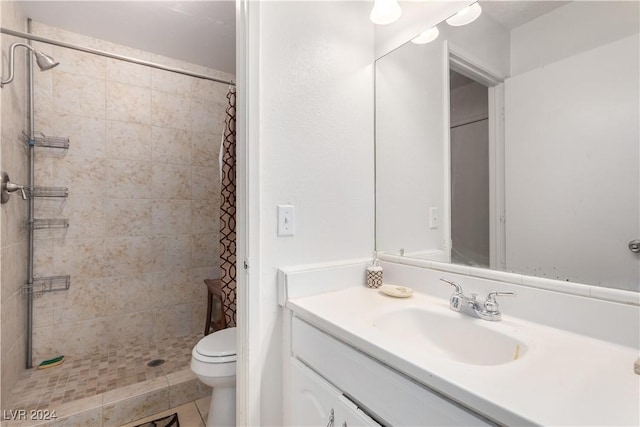 bathroom with a shower with shower curtain, vanity, toilet, and tile patterned floors