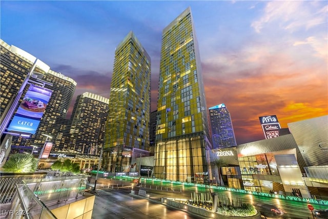 view of outdoor building at dusk