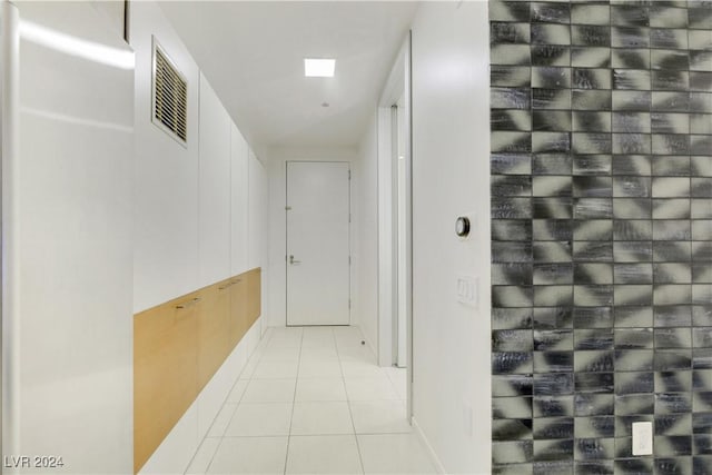 hallway with light tile patterned floors