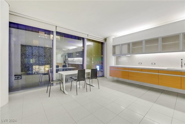 dining area with light tile patterned flooring