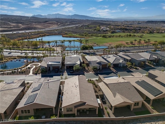 birds eye view of property featuring a water and mountain view