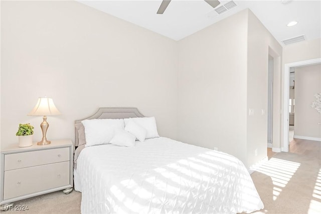 carpeted bedroom with ceiling fan