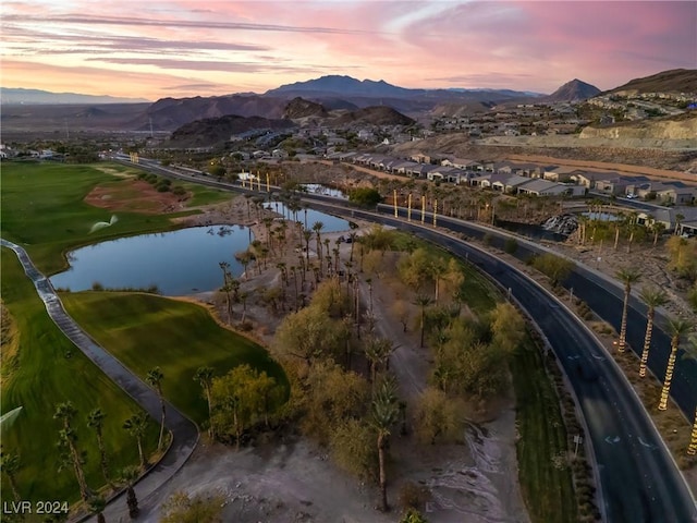 aerial view at dusk with a water and mountain view