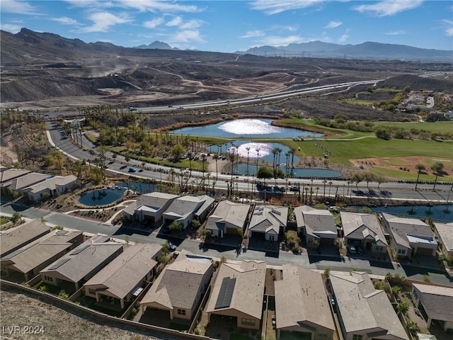 birds eye view of property featuring a water and mountain view