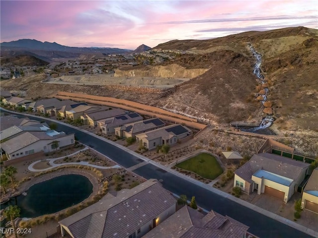 aerial view at dusk with a mountain view