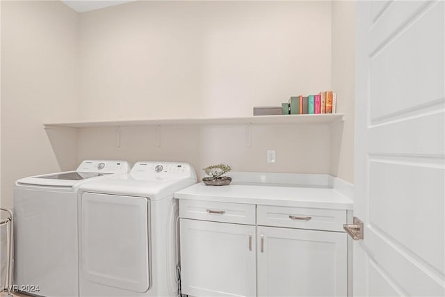 laundry area with cabinets and independent washer and dryer