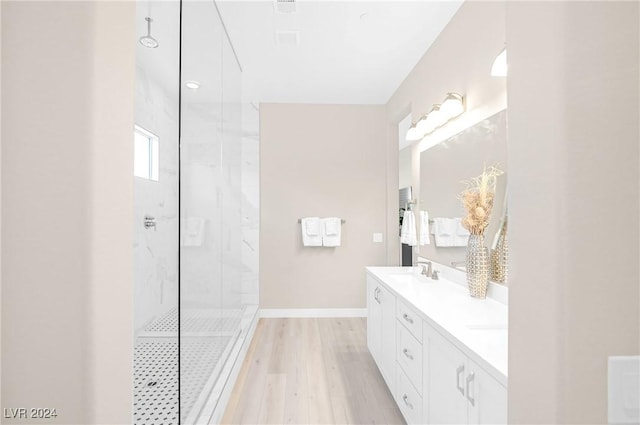 bathroom featuring vanity, hardwood / wood-style floors, and an enclosed shower