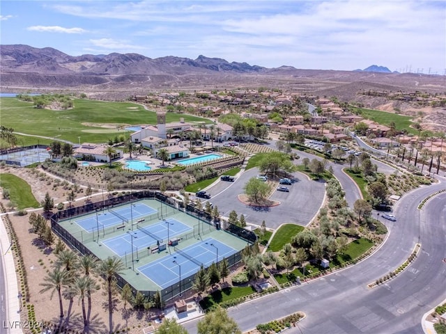 birds eye view of property with a mountain view