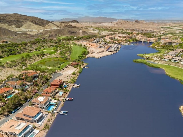 birds eye view of property featuring a water and mountain view