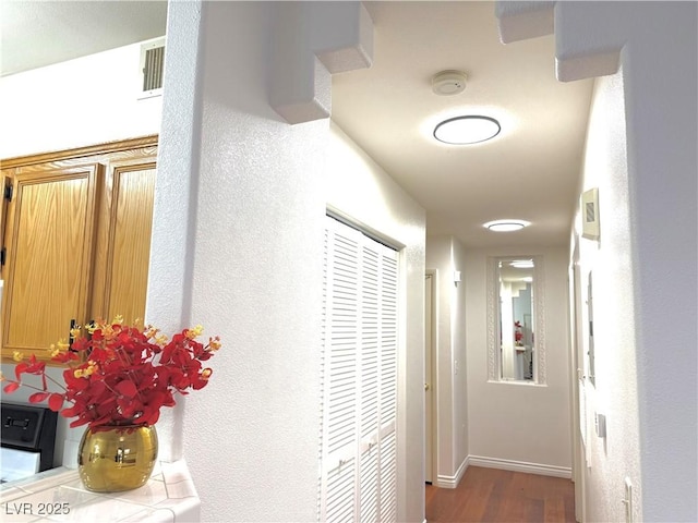 hallway with wood-type flooring