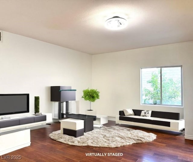 living room featuring dark hardwood / wood-style floors