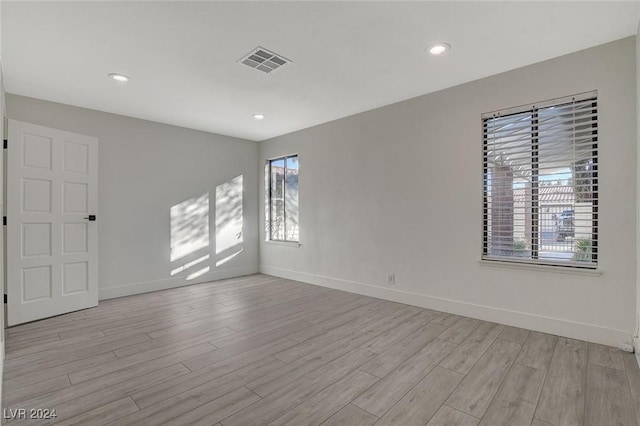 unfurnished room featuring light wood-type flooring