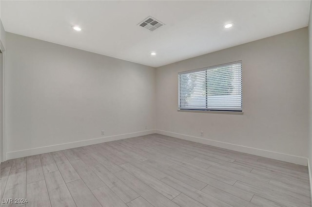 unfurnished room featuring light wood-type flooring