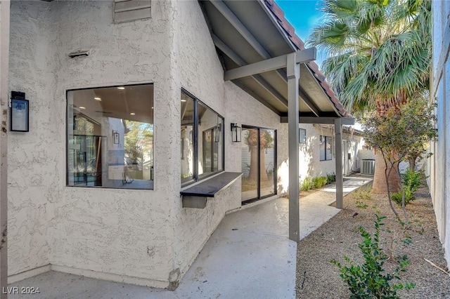 property entrance with a patio area