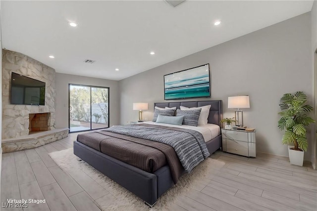 bedroom with recessed lighting, light wood-type flooring, visible vents, and access to outside