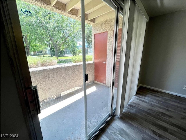 doorway to outside featuring dark hardwood / wood-style flooring