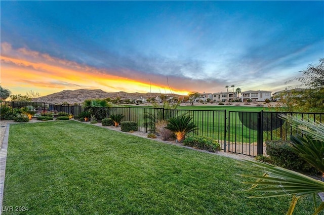 yard at dusk with a mountain view