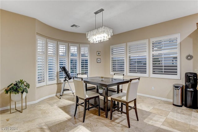 dining room featuring a notable chandelier