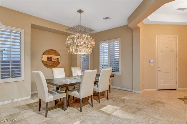 dining area with a notable chandelier