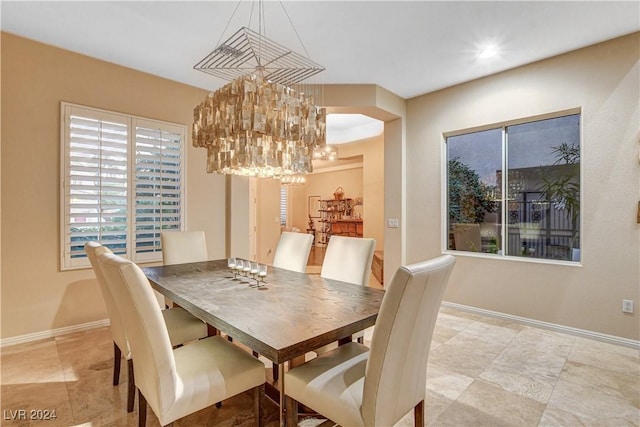 dining area featuring a chandelier