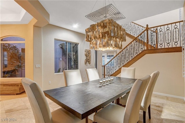 dining area featuring an inviting chandelier