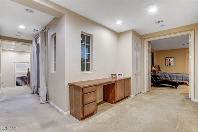 hallway with light carpet