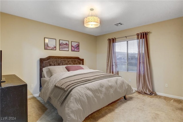 bedroom with light carpet