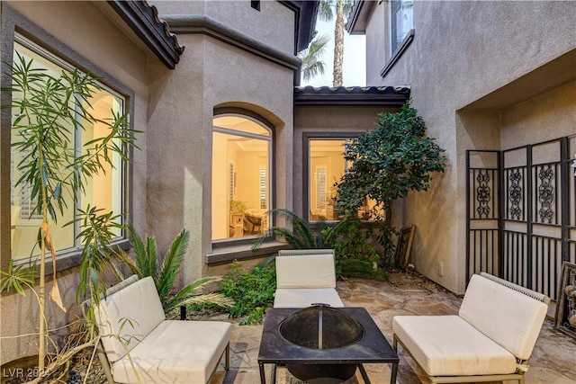 view of patio with a fire pit