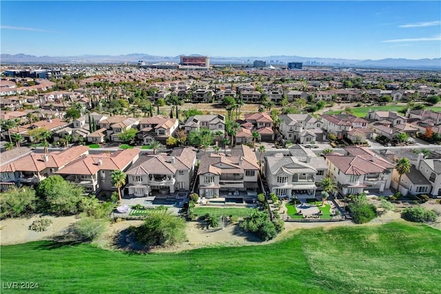 birds eye view of property with a mountain view