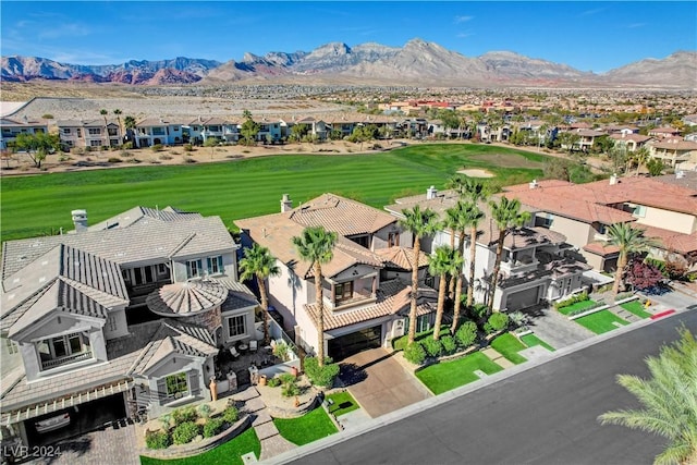 birds eye view of property with a mountain view