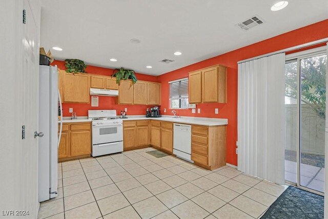 kitchen featuring sink and white appliances