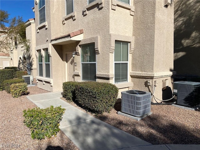 entrance to property featuring central AC unit