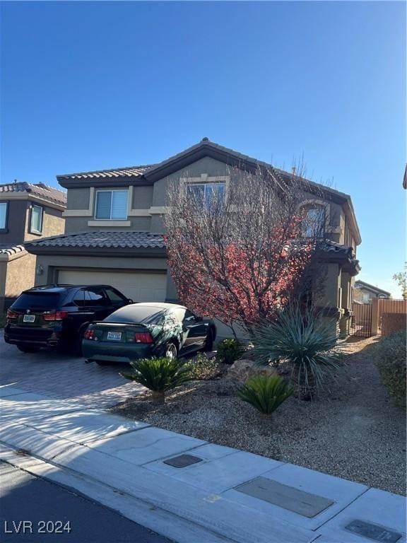 front of property with a garage