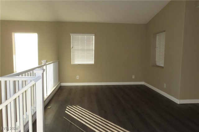 empty room featuring dark hardwood / wood-style flooring