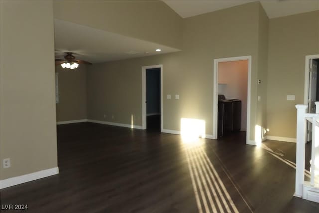 unfurnished living room featuring ceiling fan and dark hardwood / wood-style floors